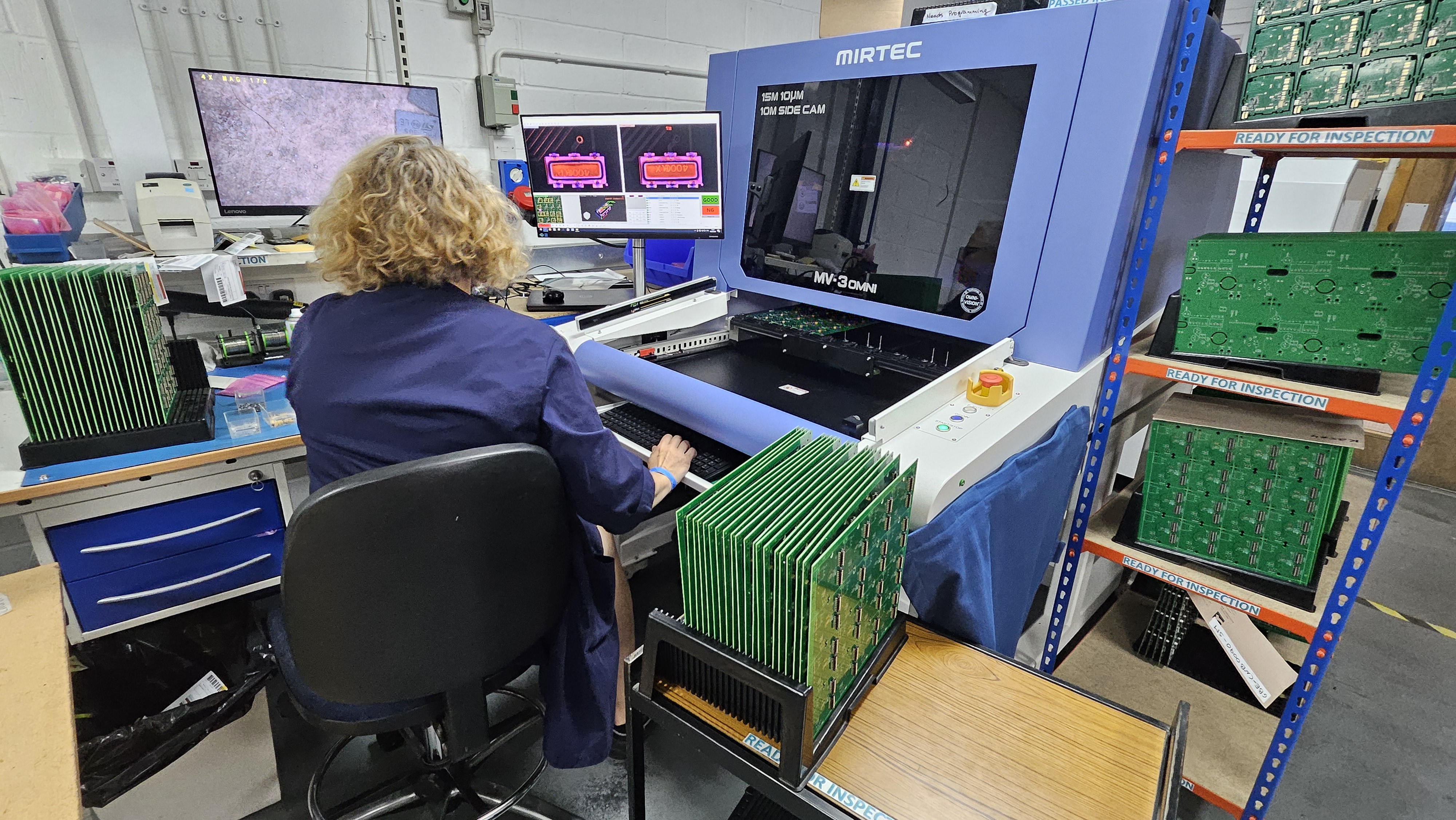 Lady on a computer checking circuit boards