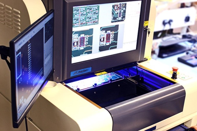 An image of an AOI machine, testing a PCB