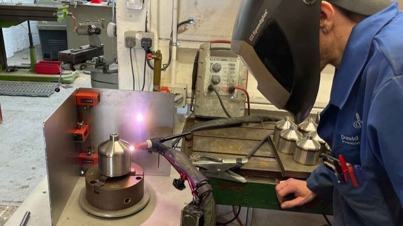 A man welding, within GB Electronics' local manufacturing process