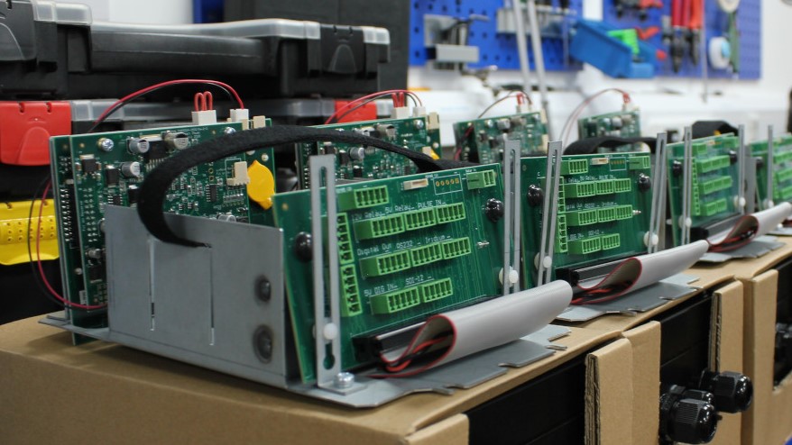 A display of internal brackets with printed circuit boards fitted